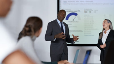 A woman putting her laptop in a bag