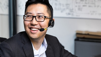 A man holding a laptop.