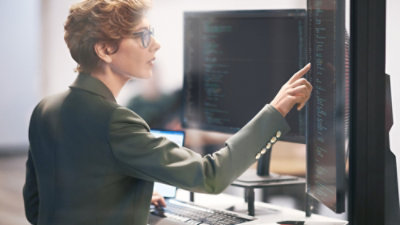 Person holding and looking at a Laptop