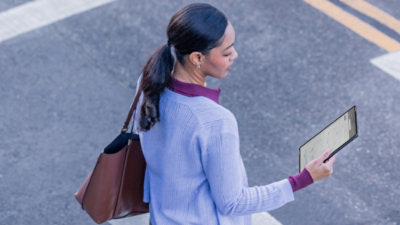 A woman is looking at the tab.