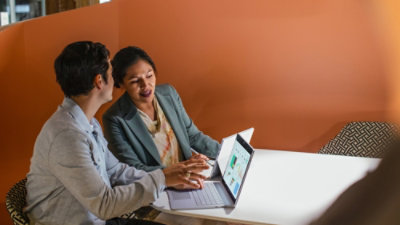 Woman and man looking at a desktop