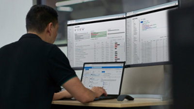 A person working on a laptop.