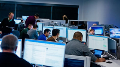 People working on computers in an office setting.