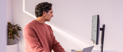 Man looking at Desktop computer