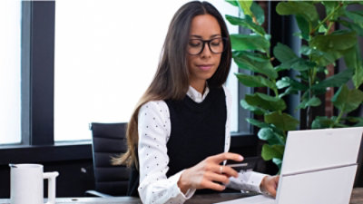 A woman working on a laptop