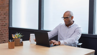 Man working on laptop in office