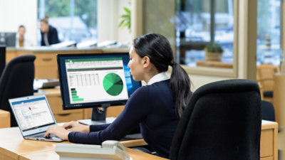 Woman working on desktop computer