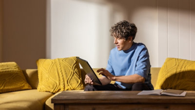 A man looking at a tablet.