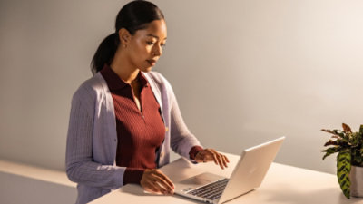 A man looking at the laptop.