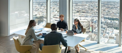 A group of people sitting around a table.