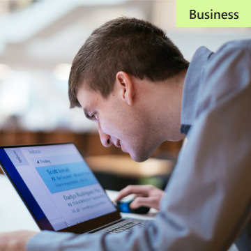 a man with a surface book