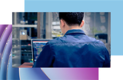 A man sitting at a desk with a laptop.