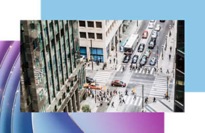 A group of people crossing a street.