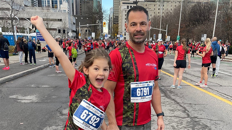 Scott Savage and his daughter taking part in marathon