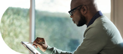 A person using a tablet and pen.