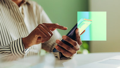 A person uses a smartphone with a digital graphic overlay.