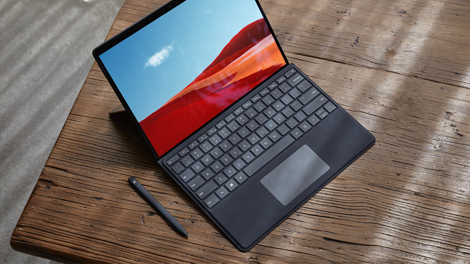 Surface Pro X in laptop mode with keyboard attached.