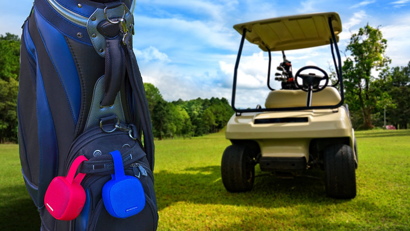 Two Soundstream H2GO Bluetooth Speaker hanging from a golf bag.