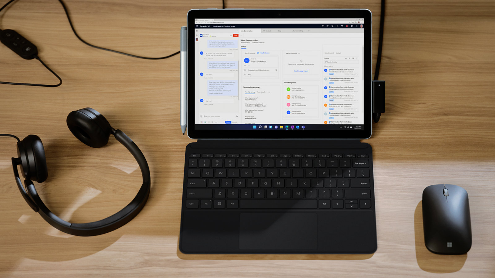 A Surface Go 4 for Business is used with a Microsoft Modern Mobile Mouse and a pair of headphones, a few examples of the accessories that Surface Go 4 for Business can connect to.