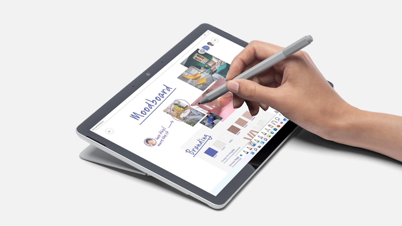 A person uses Surface Pen for Business to take notes on the touchpad of a Surface Go 4 for Business.