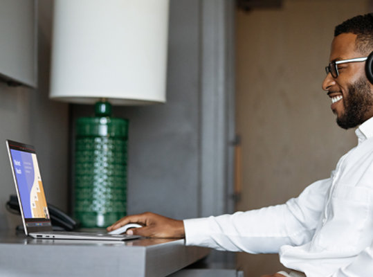 A person joins a video call on Surface Laptop 5 for Business. 