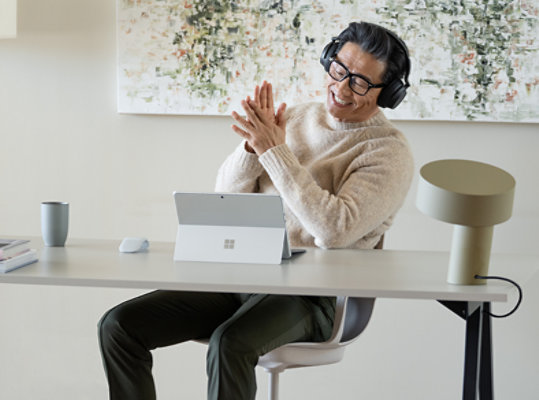 A person conducts a video call on Surface Pro 9 for Business 