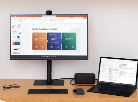Surface Laptop 5 for Business plugged in to a monitor while charging. 