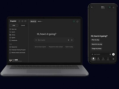 Laptop and mobile phone displaying Microsoft Copilot interface