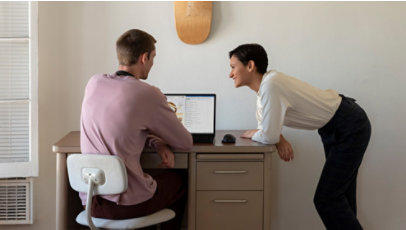 Two people look over data on a Surface Laptop 3.