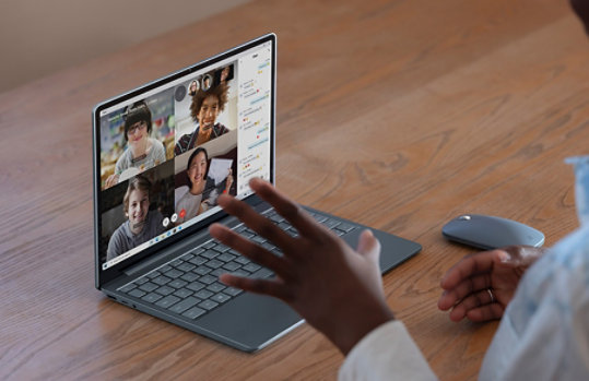 A person uses the built-in camera to join a video call on Surface Laptop Go.