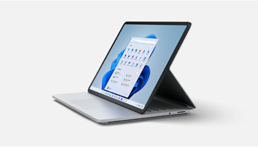 Surface Laptop Studio with keyboard attached, propped on kickstand.