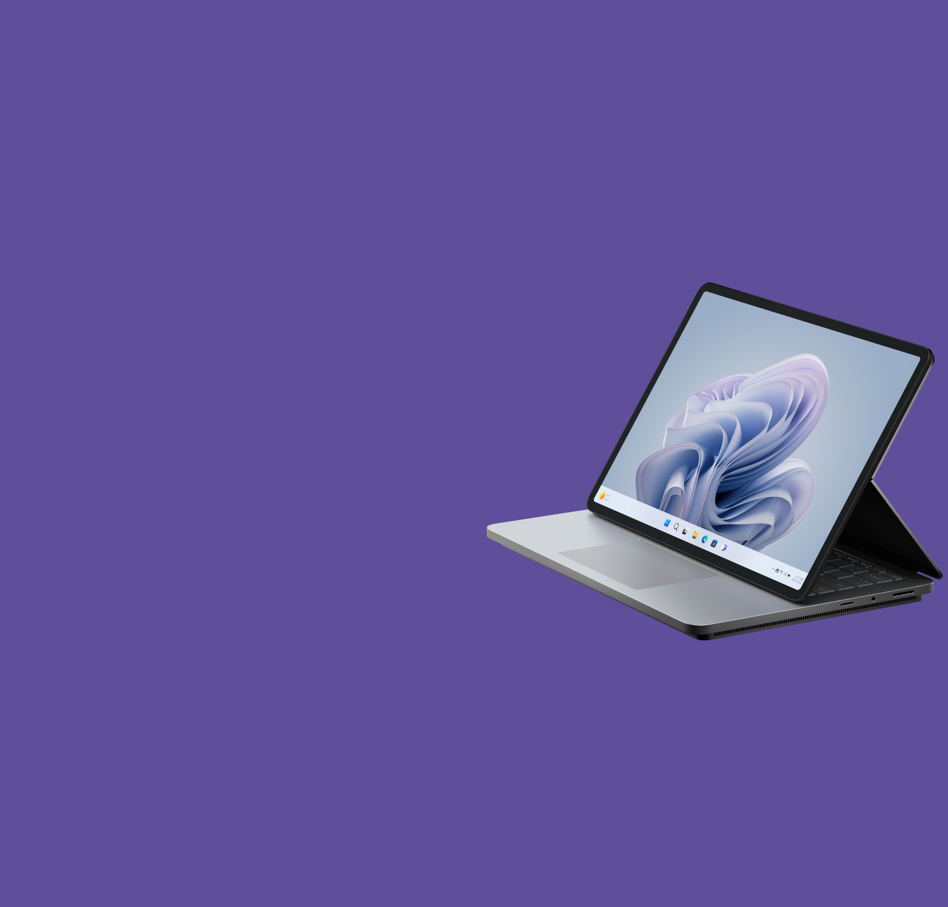 Surface Laptop Studio 2 set fra siden, der viser en Windows-blomsterskærm.