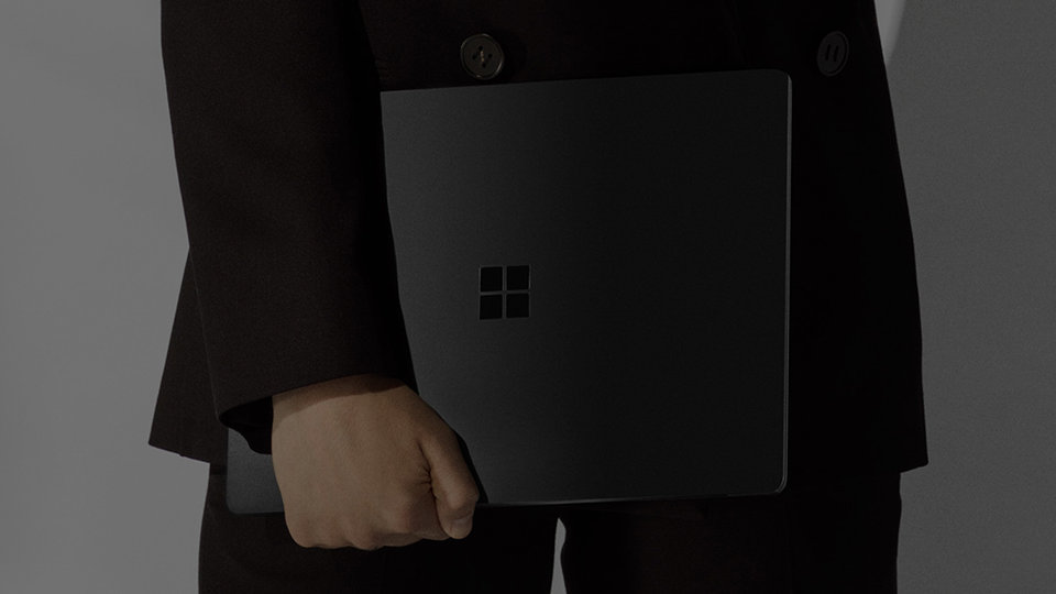 Person holding a Surface Laptop 3.