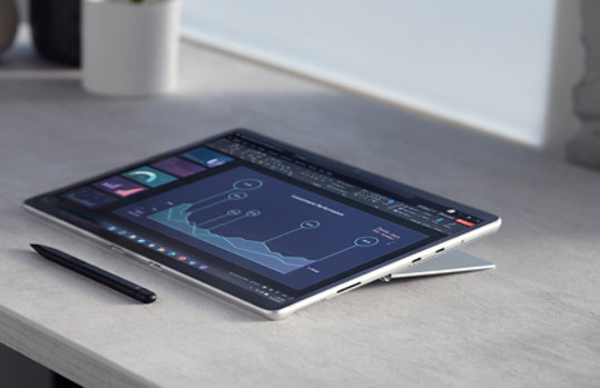 Surface Pro 8 and Surface Slim Pen 2 laying on a table. 