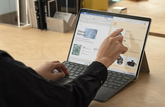 A man using Surface Pro X.