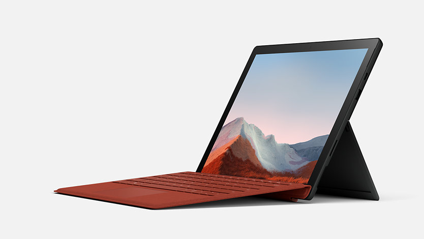 Un portatile Surface Laptop 7 con Cover con tasti Rosso papavero