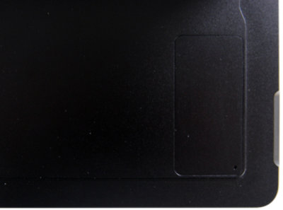 Top, close up view of a replacement SSD door for Surface Pro X in Black.