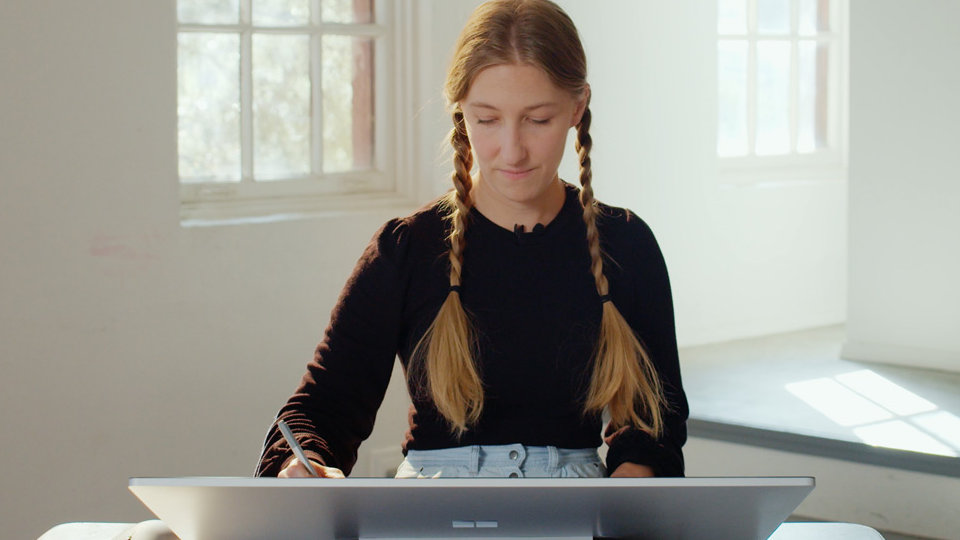CreativeLive expert Brooke Shaden working on a Surface Studio 2, using a Surface pen.