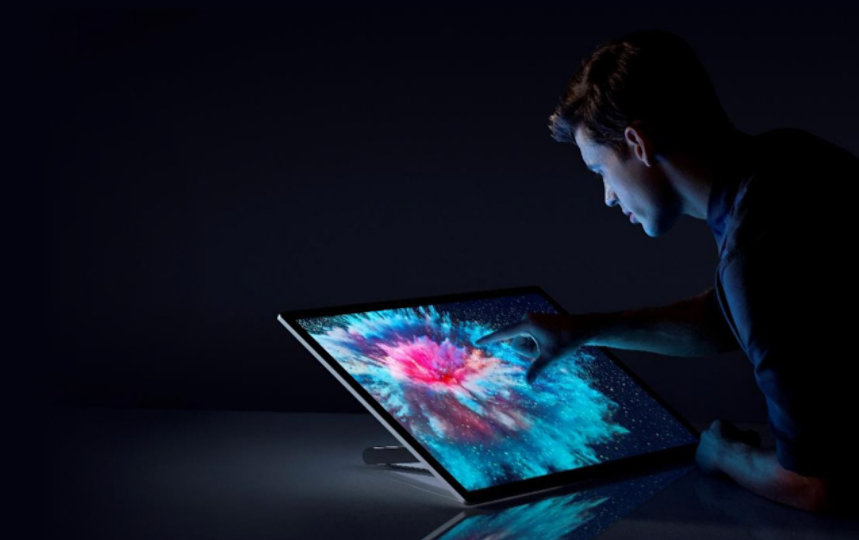 A man using Surface Studio 2.