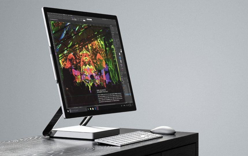 Microsoft Surface Studio sitting on a desk.