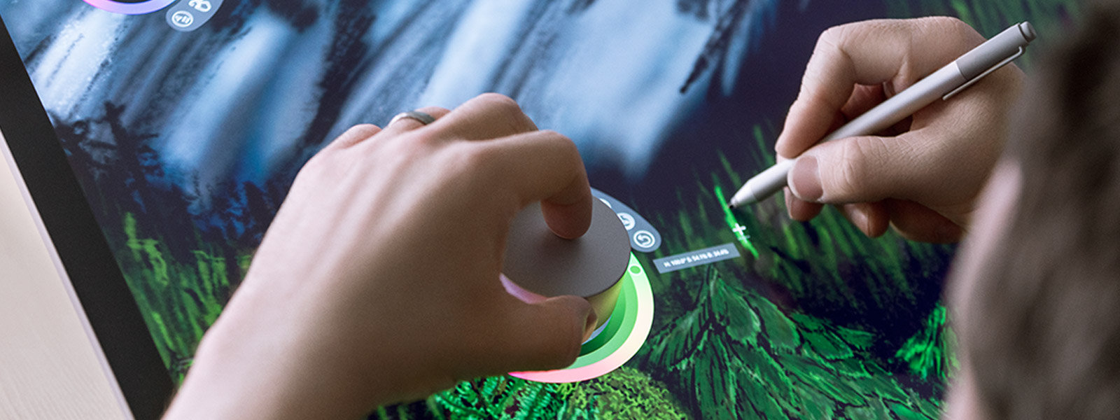 A person using Surface Dial on the screen of Surface Studio 2.