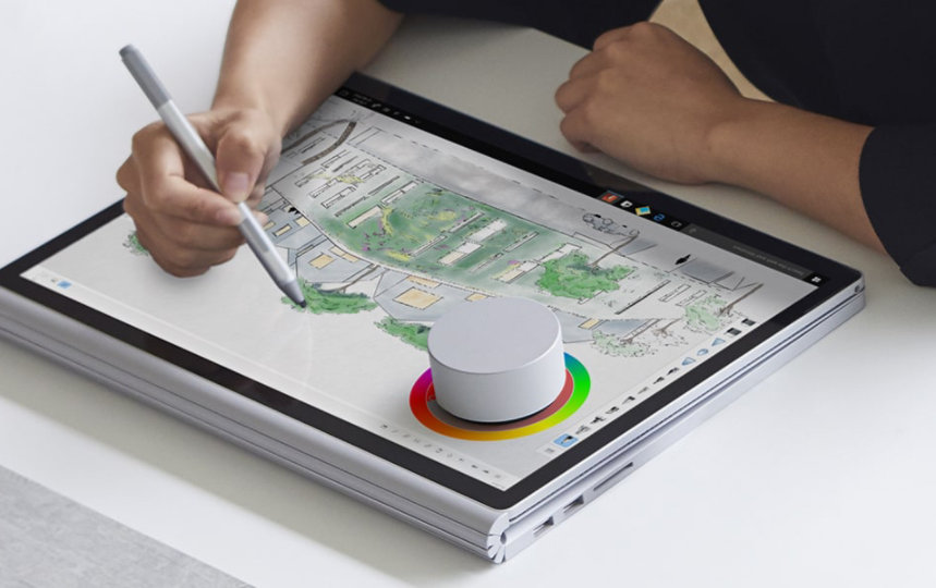 A person uses Surface Pen and Surface Dial in house-building planning.