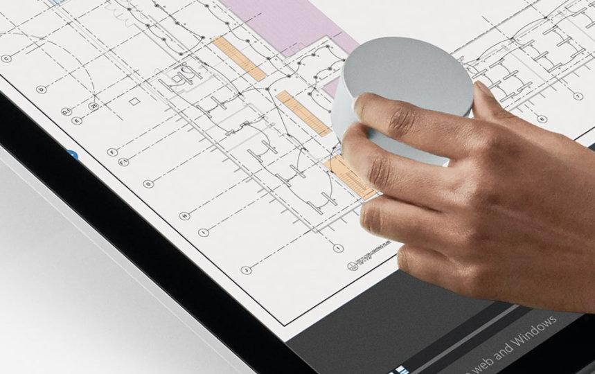 A person uses Surface Dial directly on their screen.