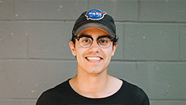 A man wearing a hat and glasses.