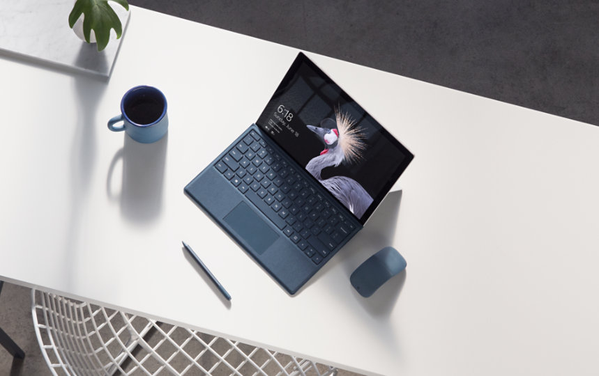 A Surface Pro and Surface accessories on a desk.