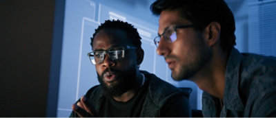 Two men looking at screen