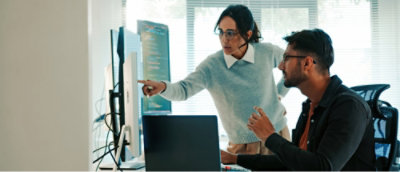 Woman pointing at the computer screen