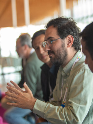 A group of people sitting in a room.