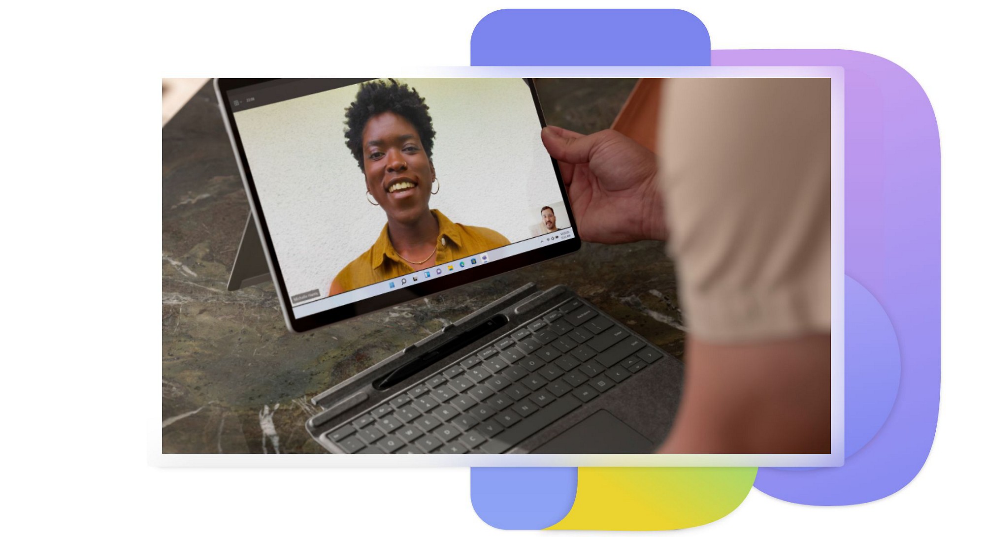 A tablet showing two people who are on a video call in Teams.