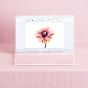 Creación mediante Microsoft Paint de una flor de color rosa sobre un portátil de cristal.
